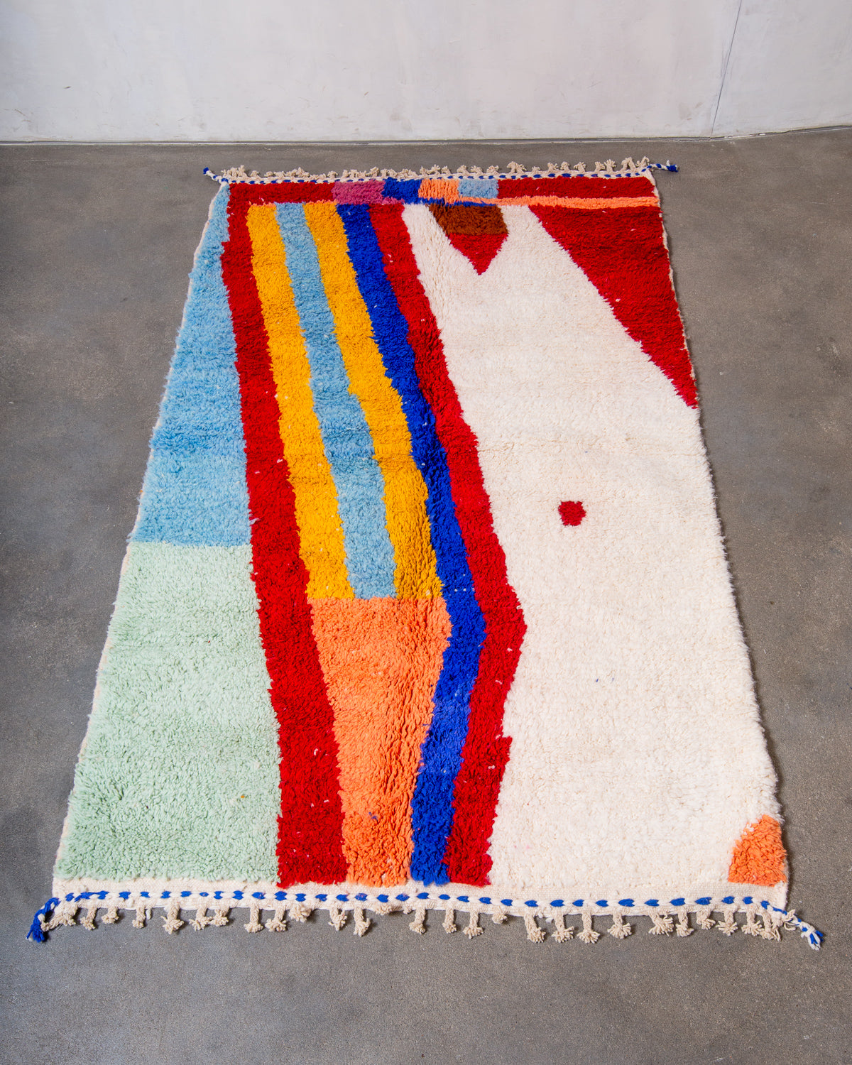 Modern, designer, handcrafted Berber rug from Morocco. Beniourain carpet with beautiful colours and patterns and fluffy wool texture.